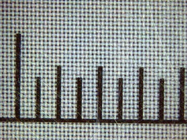 Polyester mesh 100T-40 under the microscope with scale